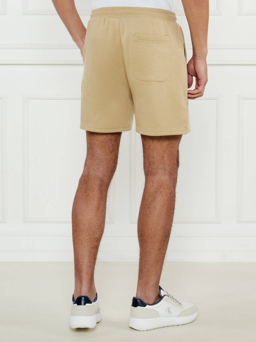 detail Tommy Jeans pánske béžové šortky