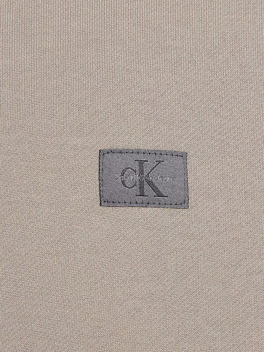 detail Calvin Klein pánska béžová mikina
