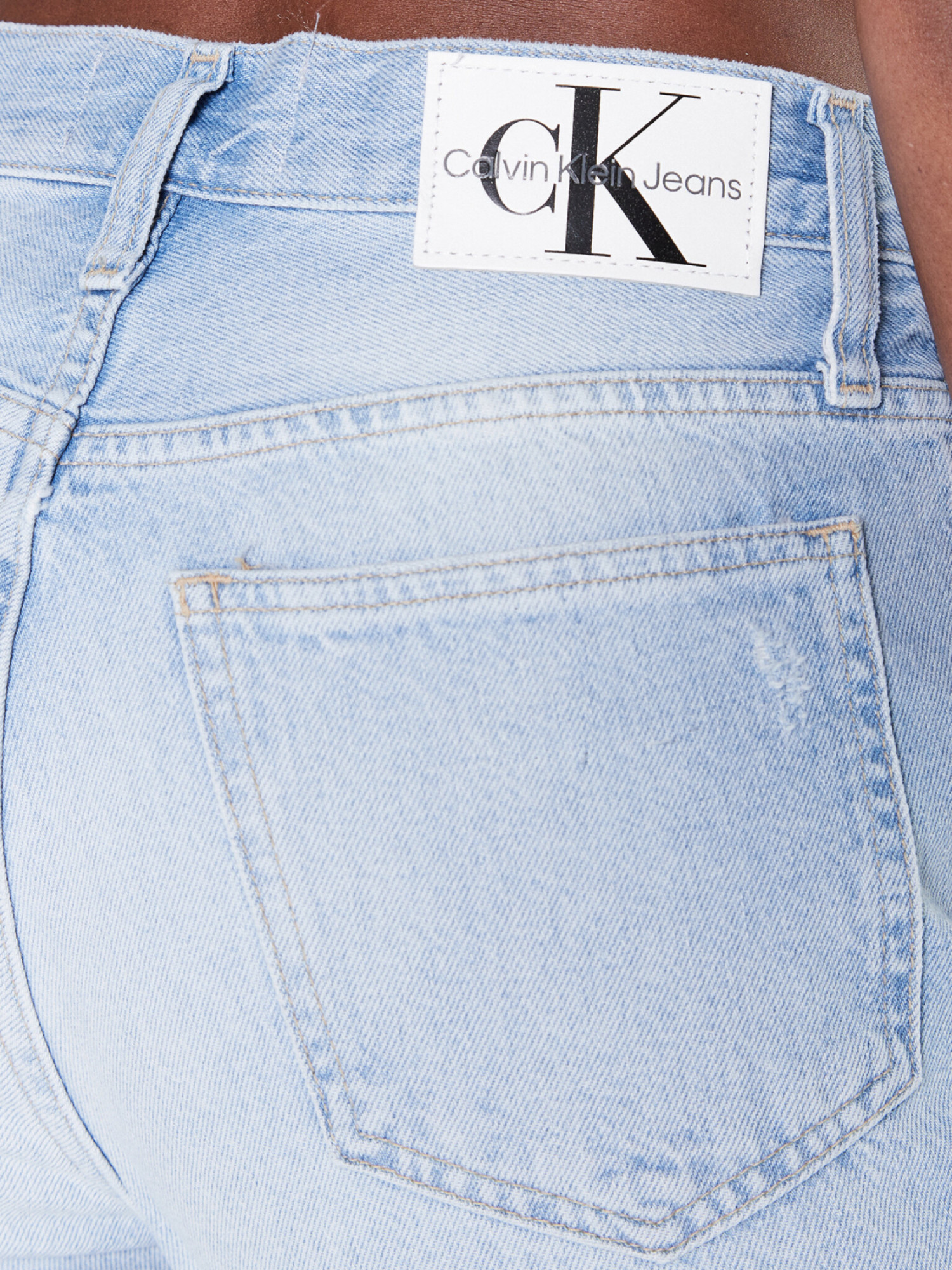 detail Calvin Klein dámske modré džínsy