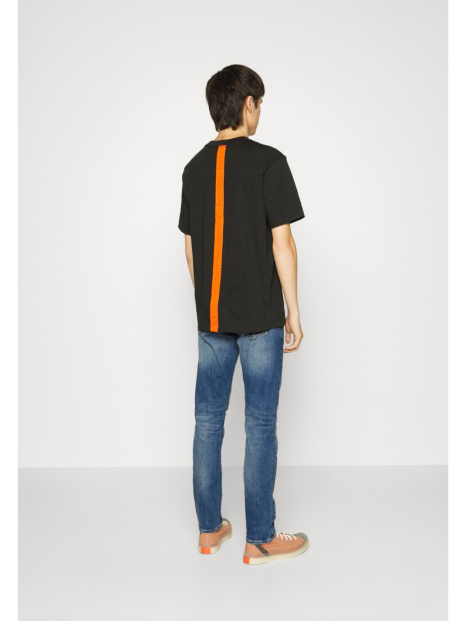 detail Calvin Klein pánske modré džínsy SLIM