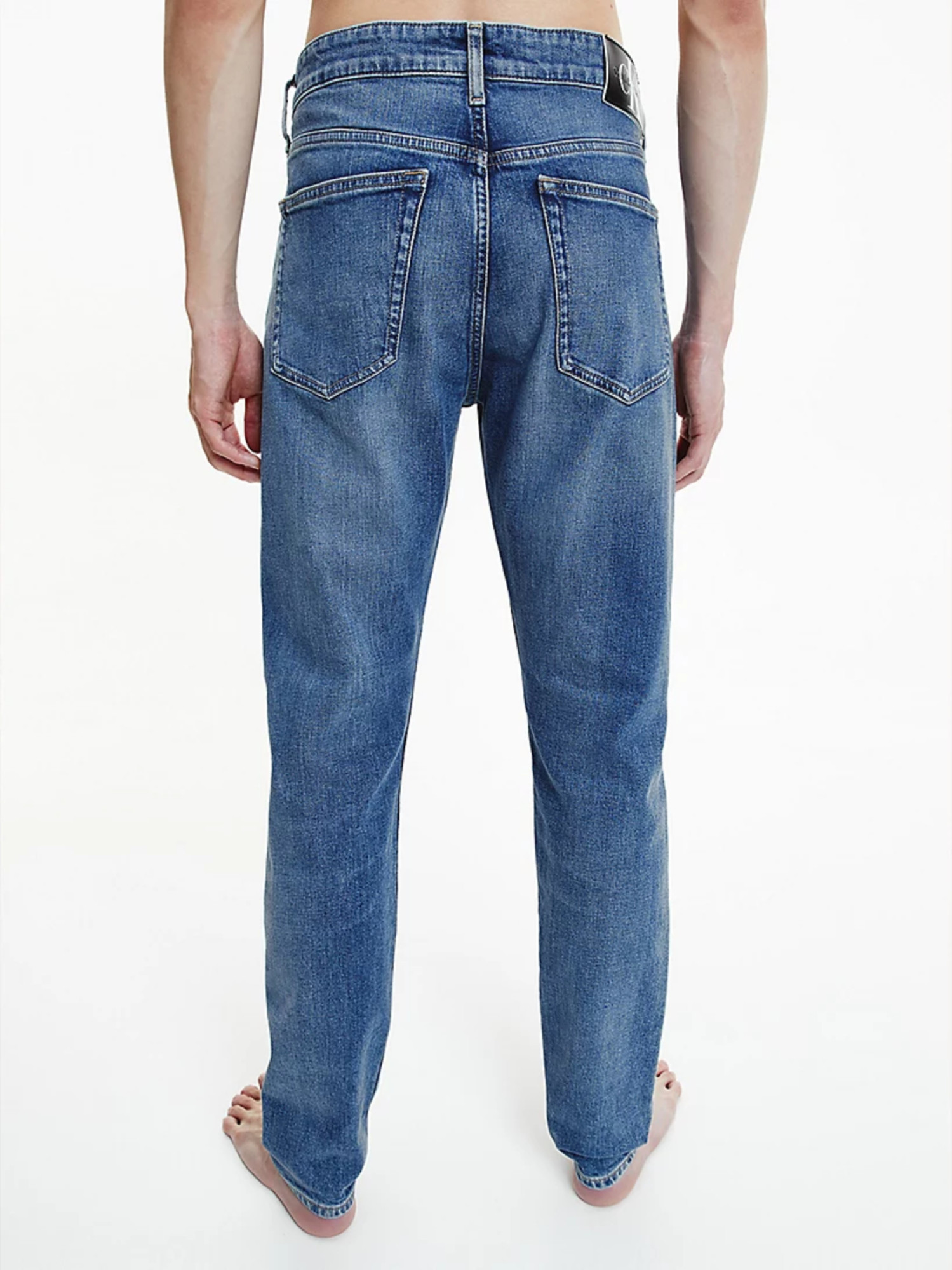 detail Calvin Klein pánske modré džínsy